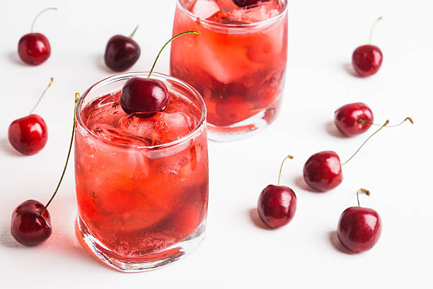 Red cocktail with cherry stock photo