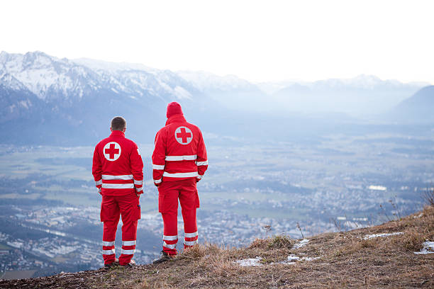 Red Cross helper in the Mountain stock photo