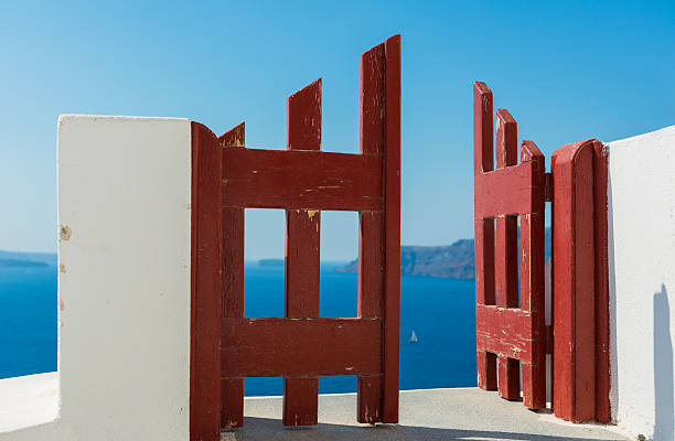 Red door and the boat, Santorini Oia village stock photo