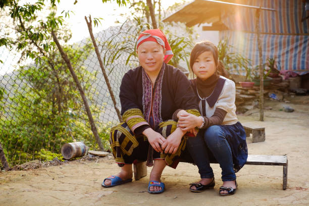 Red Dzao ethnic minority family near the home. stock photo