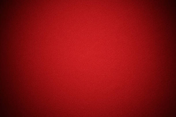 Red fabric texture background with spotlight.Studio shot.