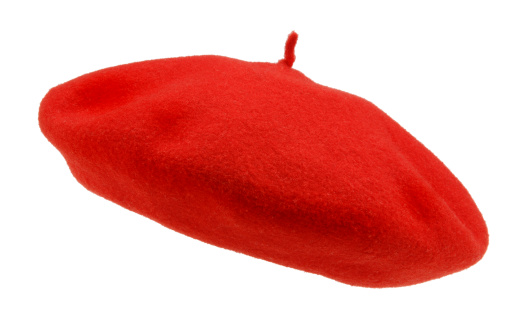 Red beret hat on white background.