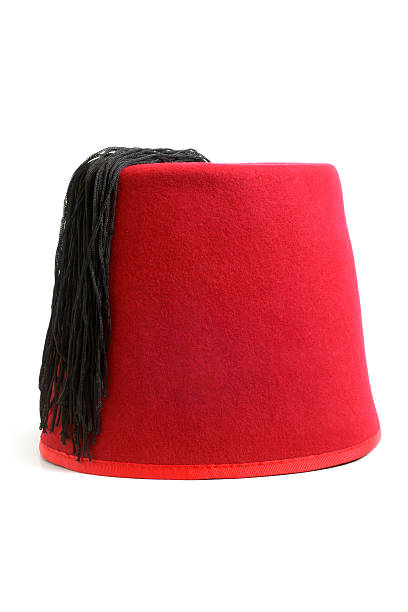 Red fez hat from Turkey isolate on white stock photo
