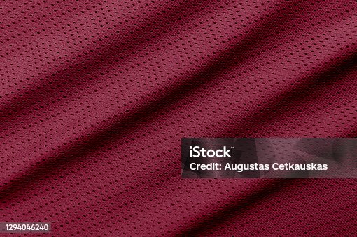 istock Red football, basketball, volleyball, hockey, rugby, lacrosse and handball jersey clothing fabric texture sports wear background 1294046240