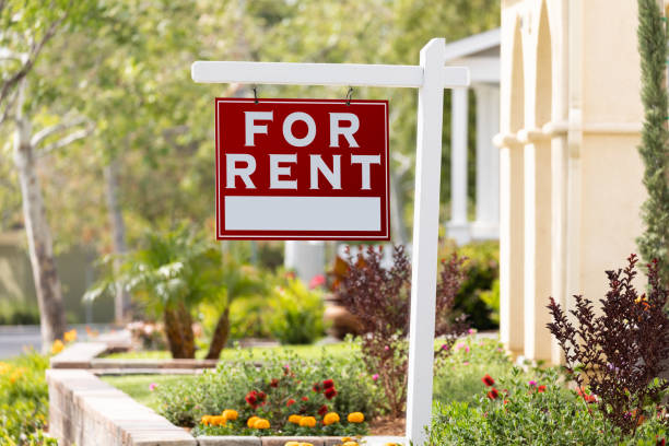 Red For Rent Real Estate Sign in Front House stock photo