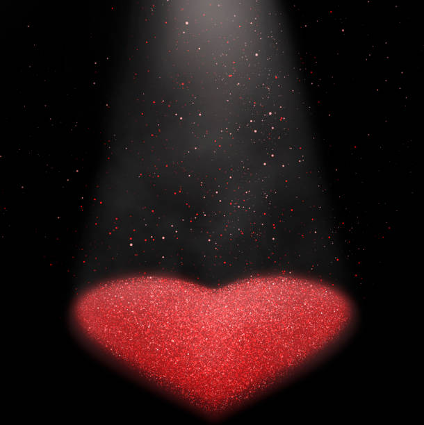 Red heart shape stage Red glitter falling with heart shape spot light coming from above, creating the beautiful shiny heart on the floor. staging light stock pictures, royalty-free photos & images