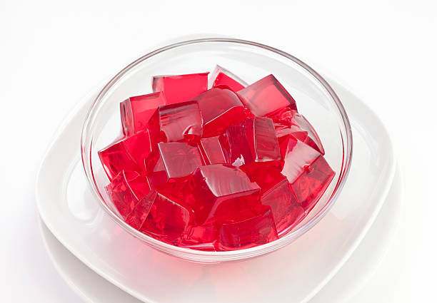 Red jelly in a glass bowl Red jelly gelatin stock pictures, royalty-free photos & images