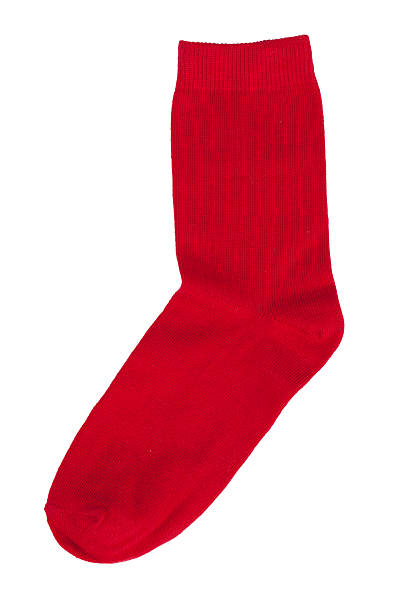 Red knitted sock Red knitted sock lying on a white background sock stock pictures, royalty-free photos & images