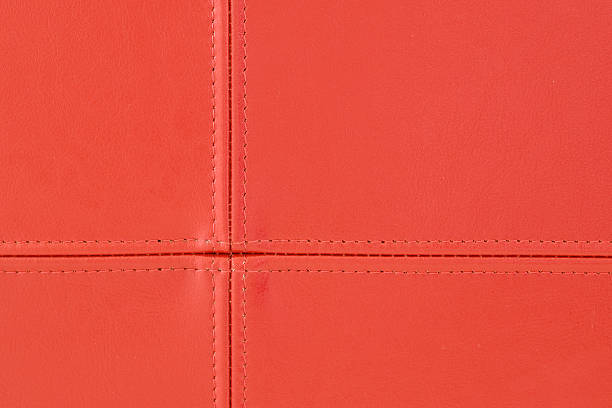 Red leather stitching stock photo