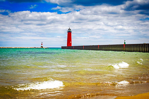 Red lighthouse at the entrance to Kenosha harbor in Wisconsin stock photo