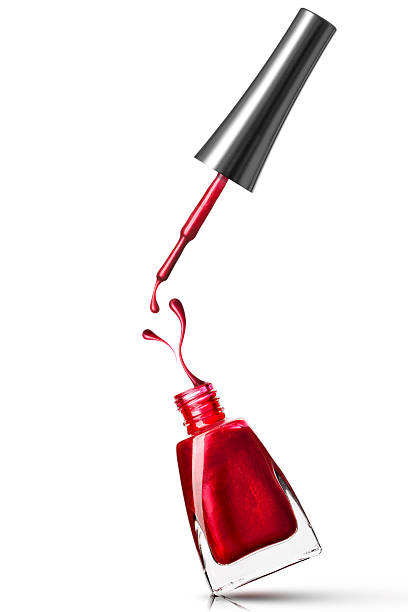 red nail polish bottle with open cap - nail polish bottle close up stockfoto's en -beelden