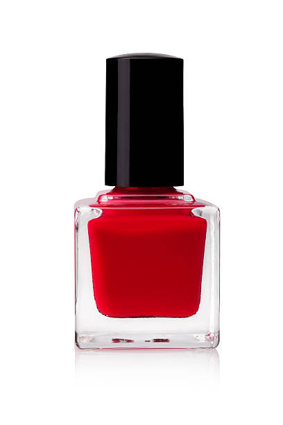 red nail polish in a glass jar - nail polish bottle close up stockfoto's en -beelden