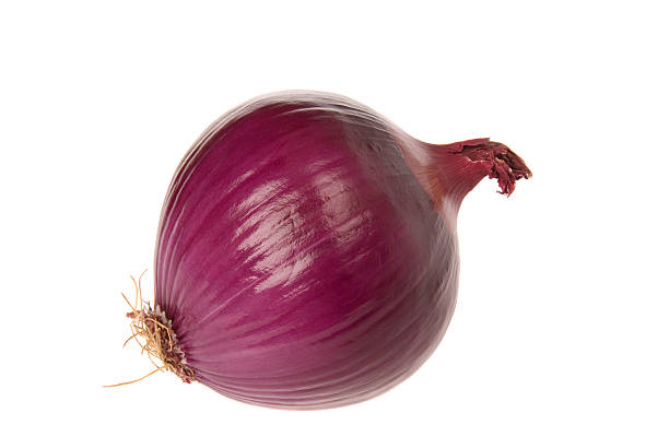 A red onion on a white background stock photo
