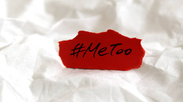A red paper with # MeToo on the white background. #MeToo as a new movement. A red paper with # MeToo on the white background. #MeToo as a new movement. me too social movement stock pictures, royalty-free photos & images
