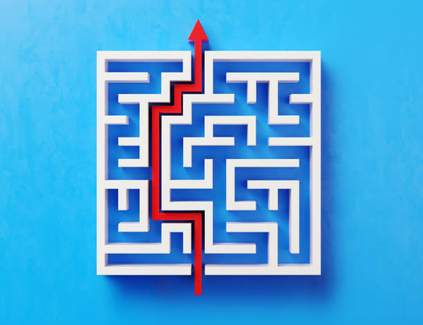 Red Path Across A White Maze On Blue Background Red path across a white maze on blue background. Horizontal composition with copy space. Directly above. maze photos stock pictures, royalty-free photos & images