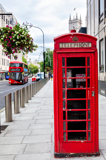 London - UK, Aug 19, 2021 : Red phone booth and Double Decker Bus in London