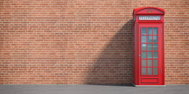 Red phone booth on brick wall background. London, british and english symbol. Space for text Red phone booth on brick wall background. London, british and english symbol. Space for text. 3d illustration red telephone box stock pictures, royalty-free photos & images