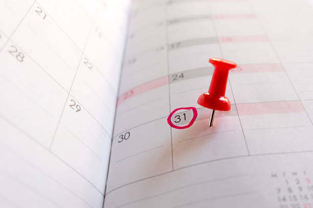 Red push pin on calendar, Red circle on 31. Red push pin on calendar, Red circle on 31. deadline stock pictures, royalty-free photos & images