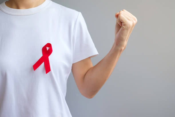 Red Ribbon for December World Aids Day (acquired immune deficiency syndrome), multiple myeloma Cancer Awareness month and National Red ribbon week. Healthcare and world cancer day concept stock photo