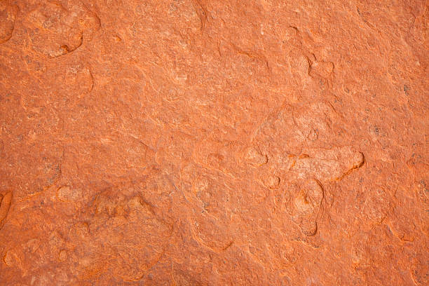 red rock texture A full frame image of a large flat red rock.  crag stock pictures, royalty-free photos & images
