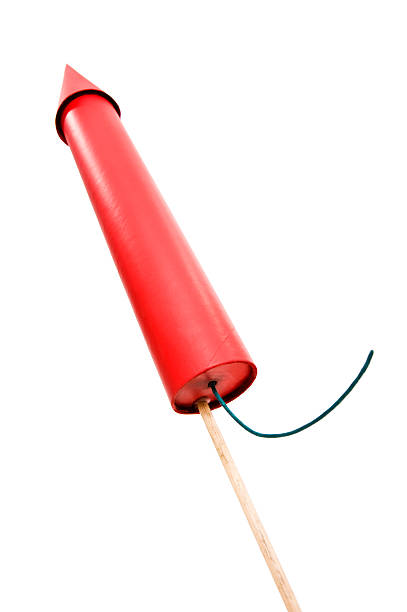 Red Rocket - fireworks against a white background Red Bottle Rocket with fuse ready for launch firework explosive material stock pictures, royalty-free photos & images