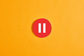 istock Red round circle with a pause button or icon 1296161082