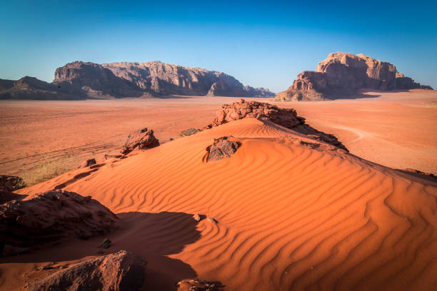 Red sand in Wadi Rum Red sand dune in Wadi Rum, Jordan jordan middle east stock pictures, royalty-free photos & images
