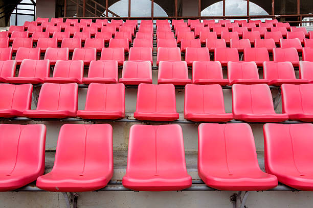 rote sitze in football stadium - stadium soccer seats stock-fotos und bilder