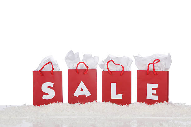 Red shopping bags that spell out the word sale stock photo