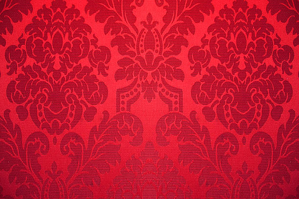 red silk wallpaper with ornaments stock photo