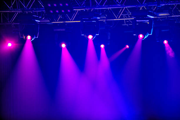 Red stage spotlights Red spotlights on empty stage staging light stock pictures, royalty-free photos & images