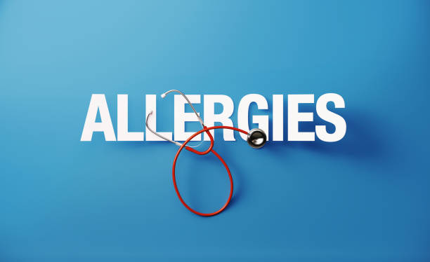 Red Stethoscope and Allergies Text on Blue Background Red stethoscope and allergies text on blue background. Health concept. Horizontal composition with copy space. Directly above. Health concept. allergy test stock pictures, royalty-free photos & images