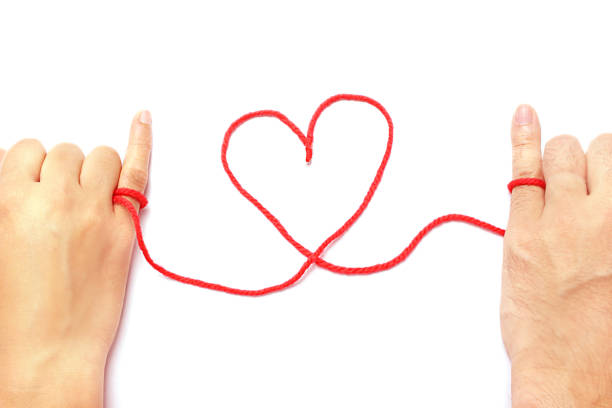Red string of fate stock photo