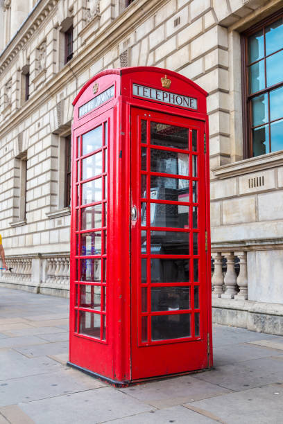 Red telephone box (booths) in London Red telephone box (booths) in London in a beautiful summer day, London, England, United Kingdom red telephone box stock pictures, royalty-free photos & images