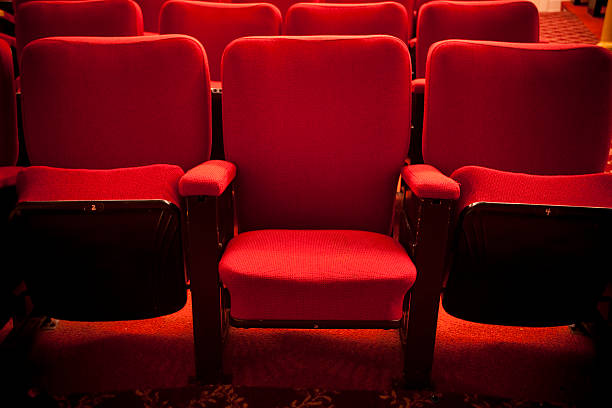 Red theater event seating Chairs in a movie, opera or concert hall seat stock pictures, royalty-free photos & images