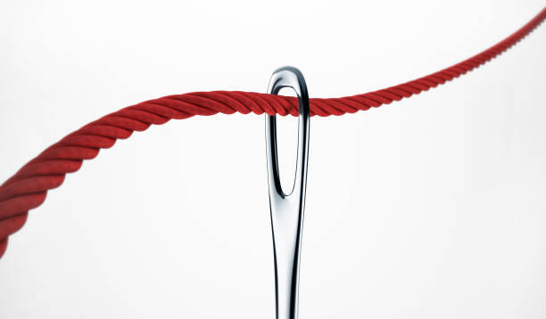 Red thread and a needle isolated on white with clipping path. 3d rendering stock photo