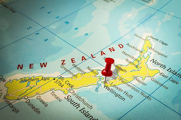 Red thumbtack in a map, pushpin pointing at Wellington stock photo