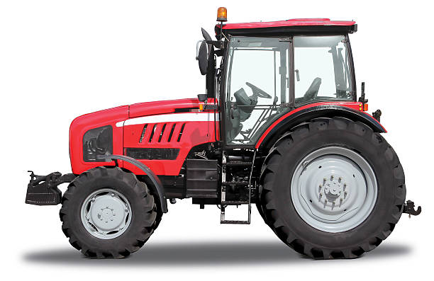 Red tractor Red tractor isolated on white background tractor stock pictures, royalty-free photos & images