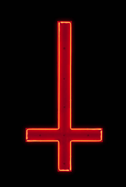 Red upside down cross Neon light shaped into and upside down red cross isolated on a black background. cross shape photos stock pictures, royalty-free photos & images