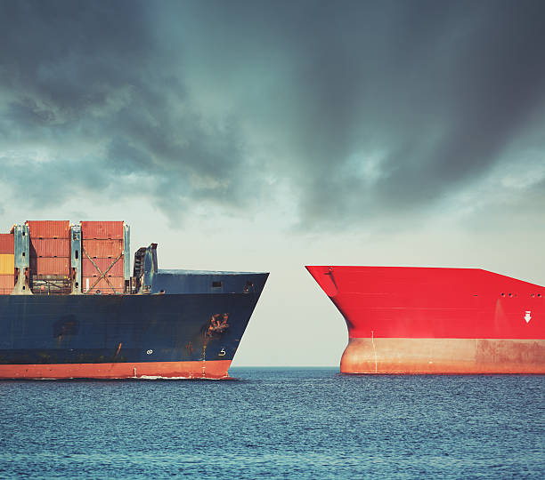 Red versus Blue Container ship and oil tanker in a narrow shipping lane. hull stock pictures, royalty-free photos & images