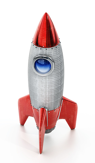 Red vintage rocket isolated on white.
