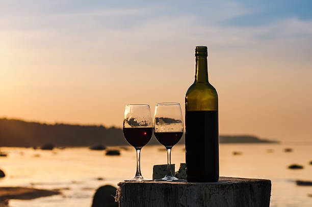 Red wine bottle and glasses stock photo