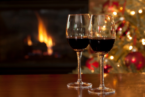 Red Wine in front of the Fireplace at Christmas Time