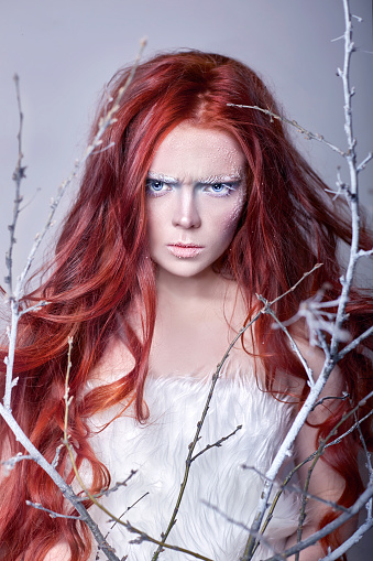 Redhead Girl With Long Hair A Face Covered With Snow With Frost