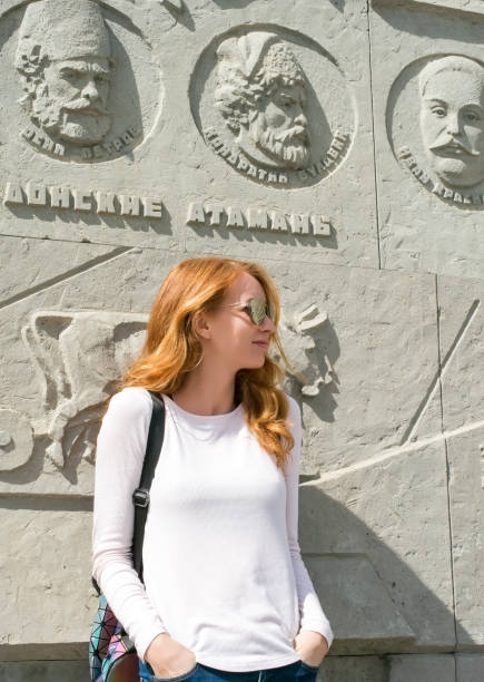 Redhead model near the monument to the Cossacks stock photo