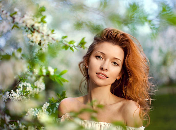Redheaded Woman in Park stock photo