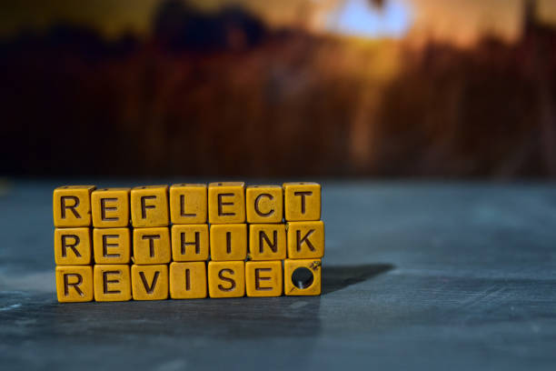 Reflect - Rethink - Revise on wooden blocks. stock photo