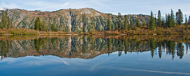 Reflection in an Alpine Lake This mountain and forest scene is reflected in the still water of Bench Lake in Mount Rainier National Park, Washington State, USA. jeff goulden panoramic stock pictures, royalty-free photos & images