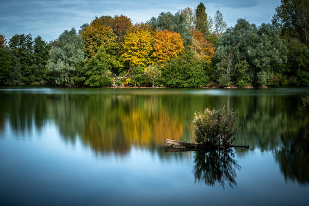 Reflection of autumn trees in the Lake stock photo