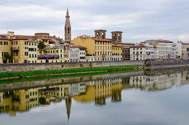 Reflections Along the Arno River in Florence, Italy Florence, Italy is known as the birthplace of the Renaissance.  Founded in 80 B.C. by Lucius Cornelius Sulla as a settlement for his soldiers, it was named Fluentia, which later became Firenze.  Renown artists like Michelangelo, Leonardo da Vinci, Botticelli and Donatello all lived, studied and worked in Florence, along with architects like Brunelleschi, who designed the dome of the city's duomo, Cattedrale di Santa Maria del Fiore.  Florence has a colorful history as a political and financial center, dominated for over 150 years by the Medici family and is also known as a fashion center.  Today, it's rich heritage in art can be enjoyed at several galleries and museums including the Uffizi and the Gallerie dell'Accademia, as well as the Pitti Palace (Palazzo Pitti).  Pictured here is the downtown district with old, but stately buildings reflected in the Arno River. botticelli stock pictures, royalty-free photos & images